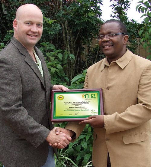 T/Dr Sbukiwe Patrick Dlamini receives his PHC Certificate - Professional Health Consultant NHA (Natural Health Academy) from Vincent Tones - Registrar